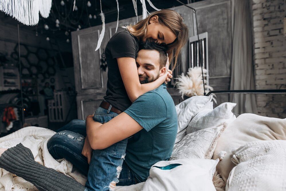 woman hugging man who raised power